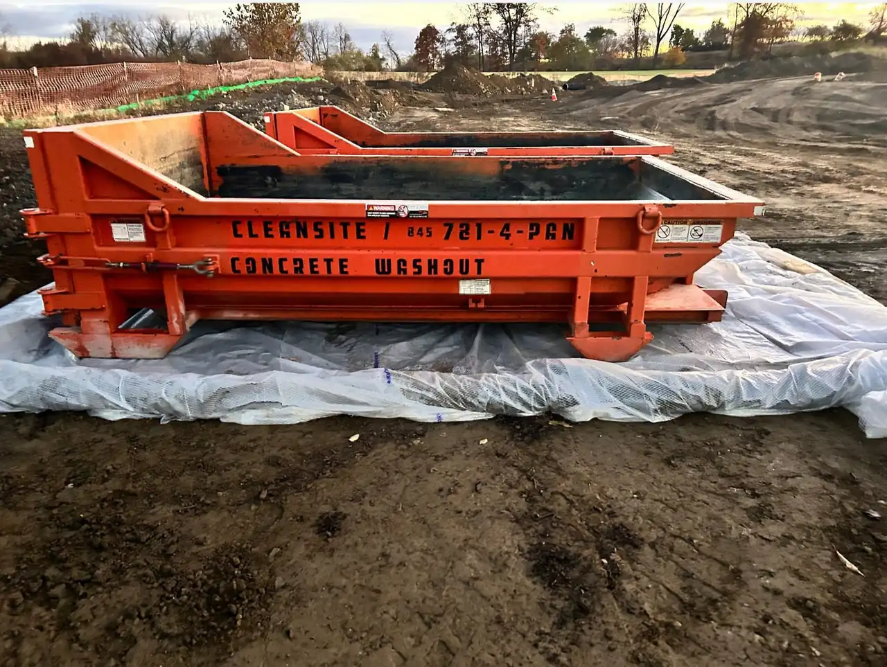 CleanSite concrete washout container with the 845-781-4-PAN number on its side, set on a liner