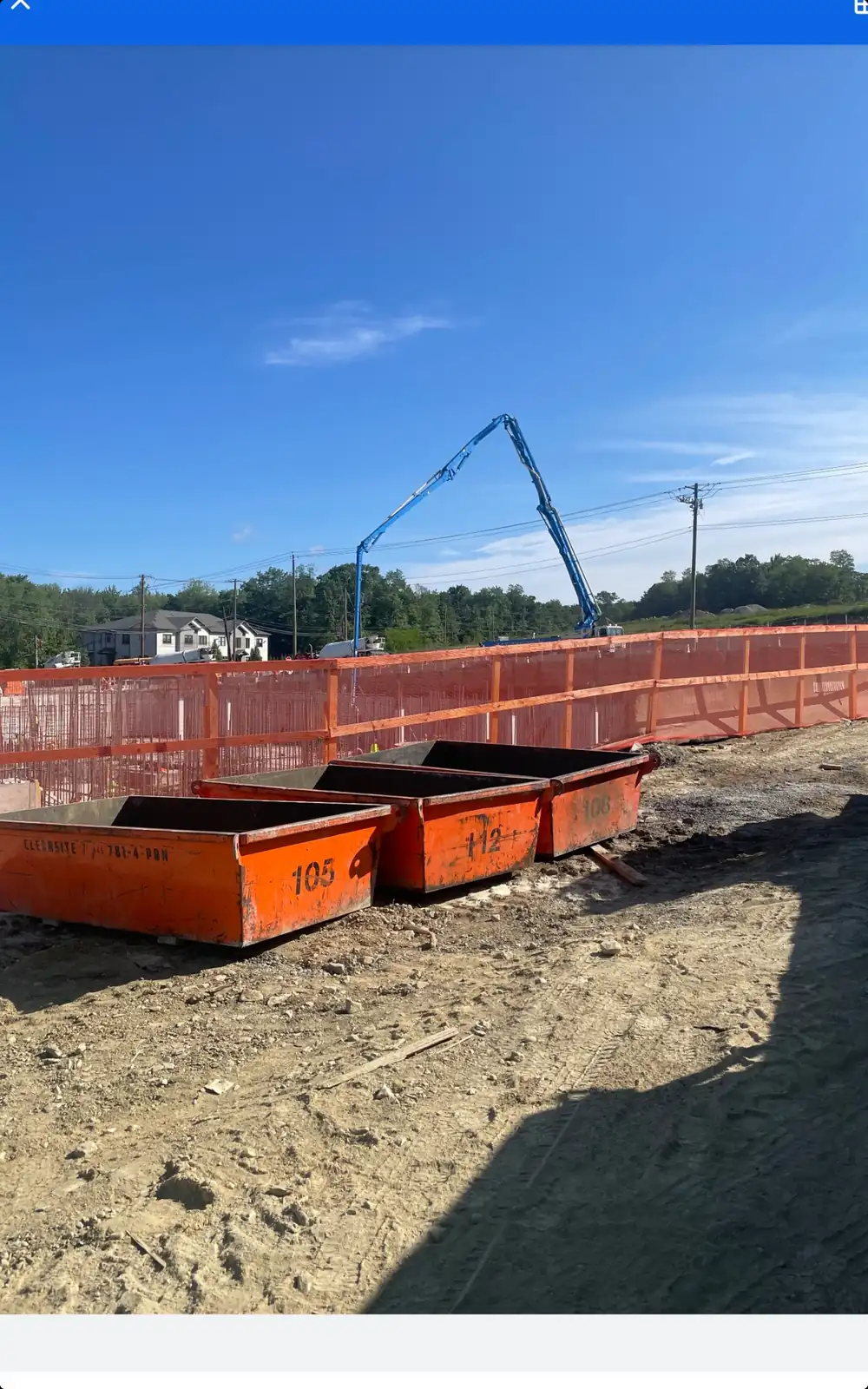 CleanSite pans lined up near a pump truck boom
