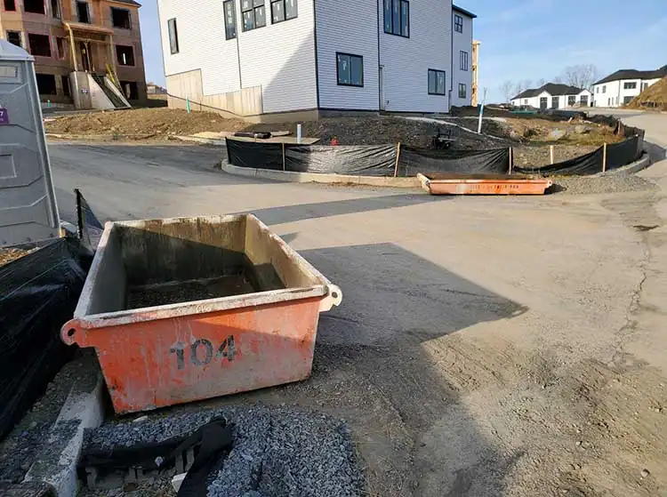 Concrete washout pan near a house