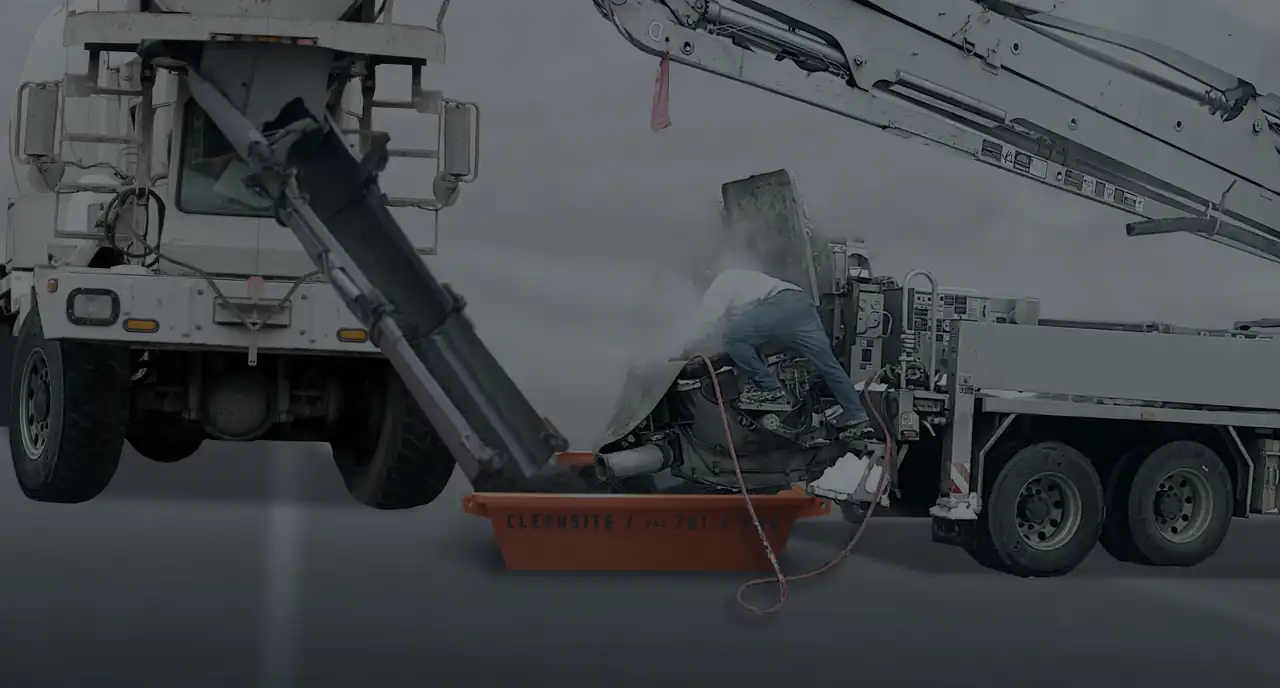 Pump truck hopper being washed out into a CleanSite pan