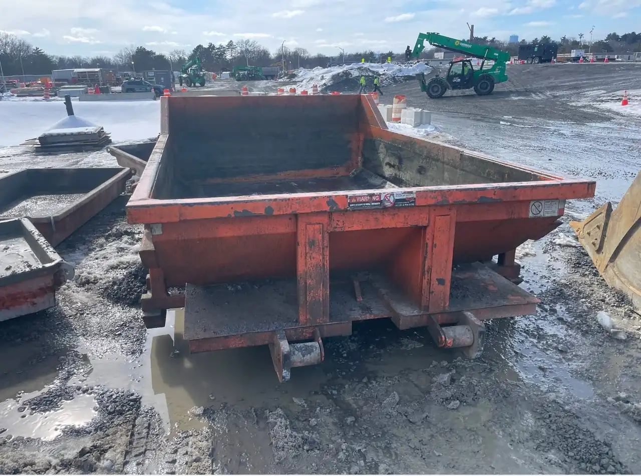 Close-up of a CleanSite washout container on a wet winter site