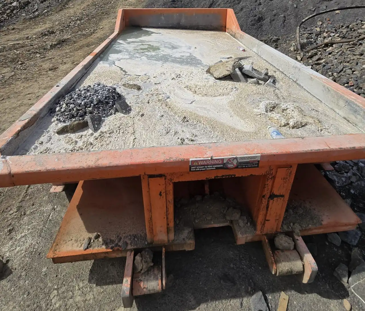 CleanSite washout container holding concrete washout and rubble