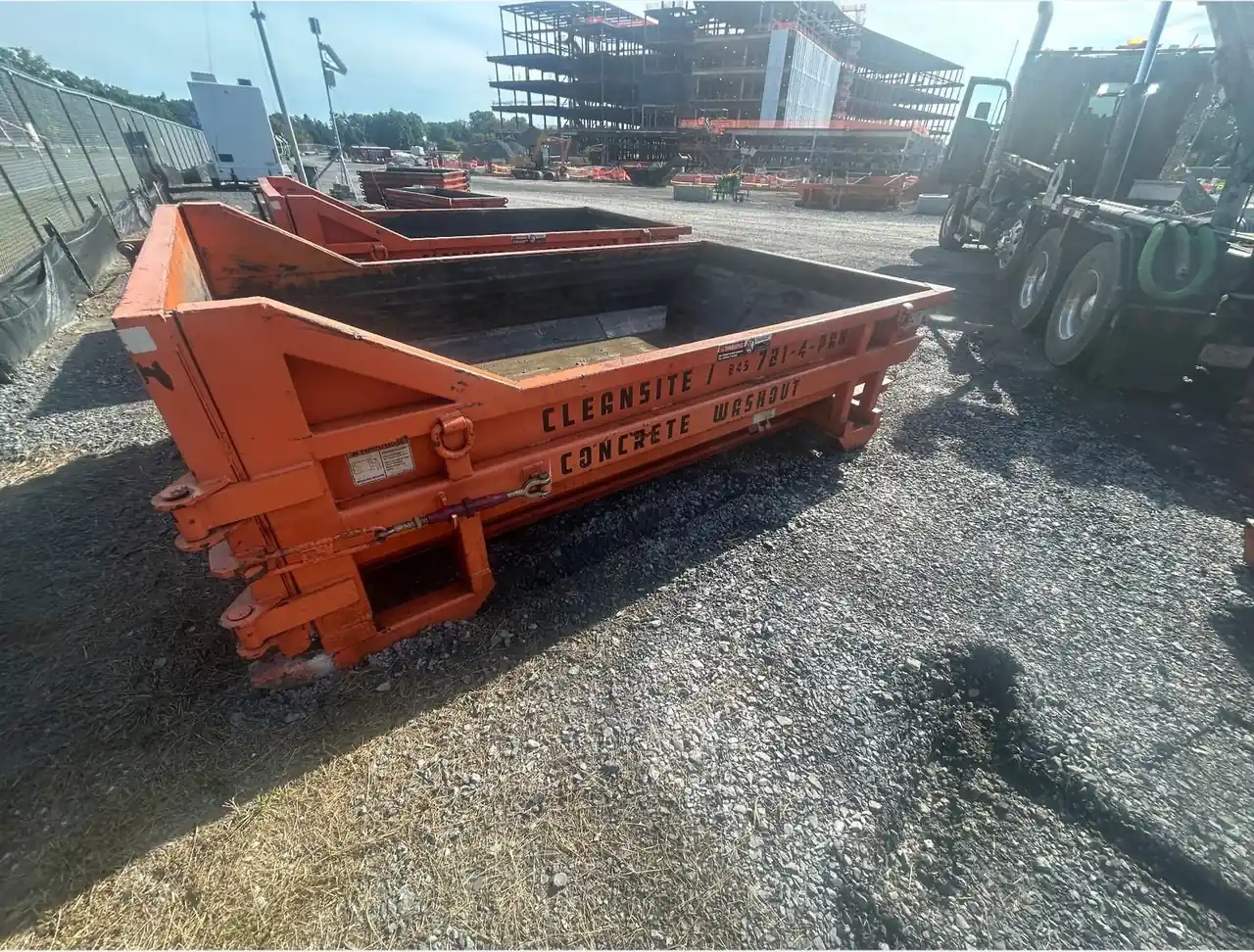 CleanSite washout containers lined up beside the truck on a commercial site
